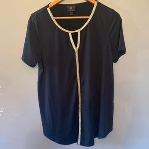 JM Collection black top with gold trim and triangle cut out in front. Size M